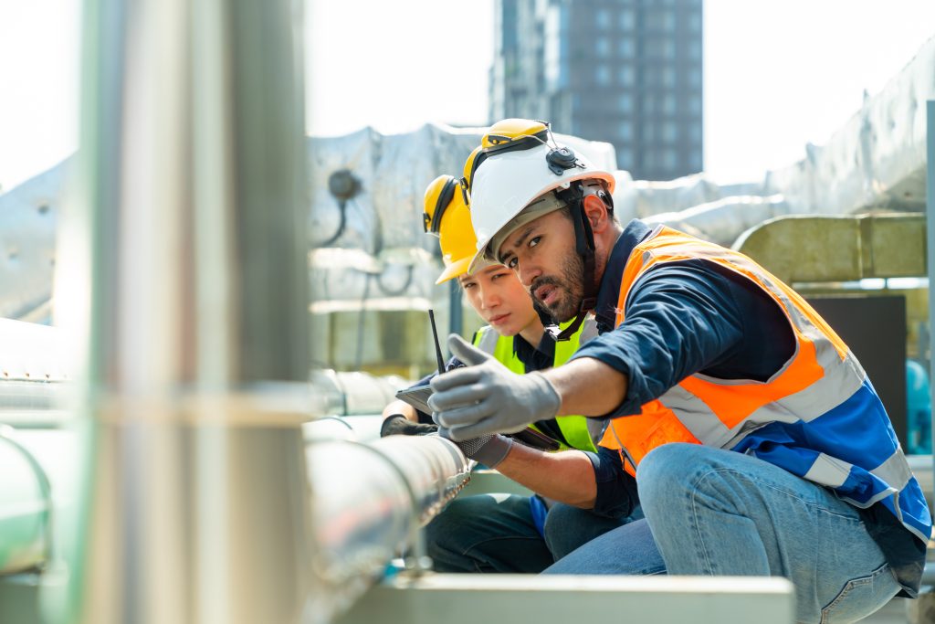 Professional Asian Man And Woman Teamwork Engineer In Safety Uniform
